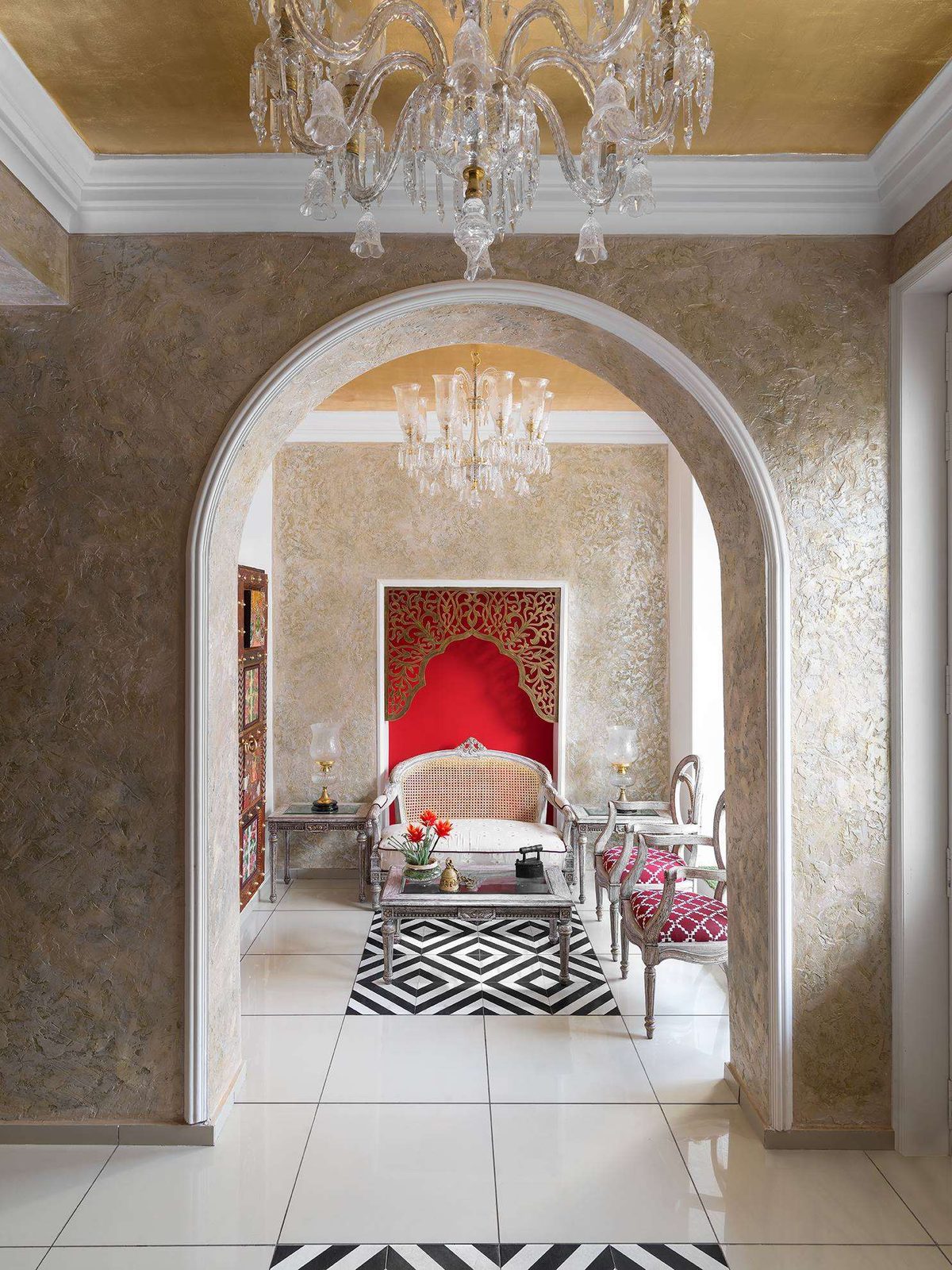 The arched entrance of Amiraah, Kanpur — a chandelier-lit passage leading to a curtained niche