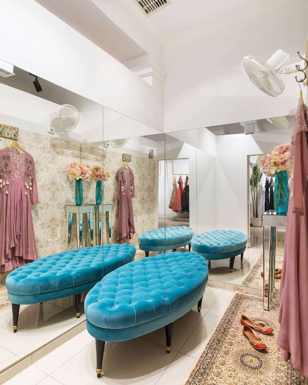 The bright marble showroom floor at Amiraah with soft seating